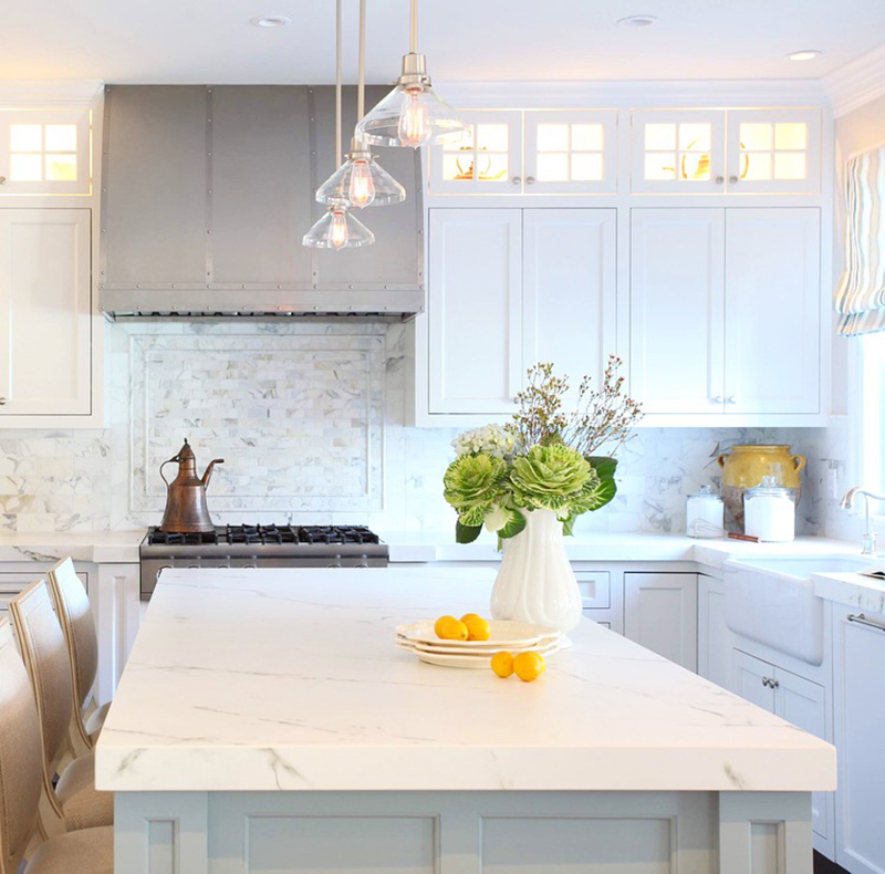 After: marble accents give the kitchen a luxurious feel.